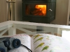 Wood-fired heater makes the lounge cosy as well as comfy.